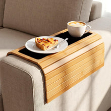 Foldable bamboo sofa arm tray in natural finish resting on a couch armrest — Japandi home accessory Australia