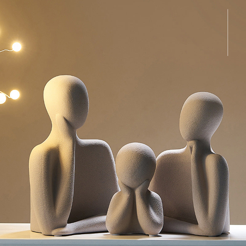 Ceramic sculptural figures detail — textured matte finish in neutral tones