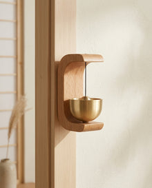 Magnetic Wooden Door Bell mounted on door frame in Japandi entryway