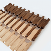 Piano key wooden coat rack mounted in hallway — minimalist Japandi storage Australia